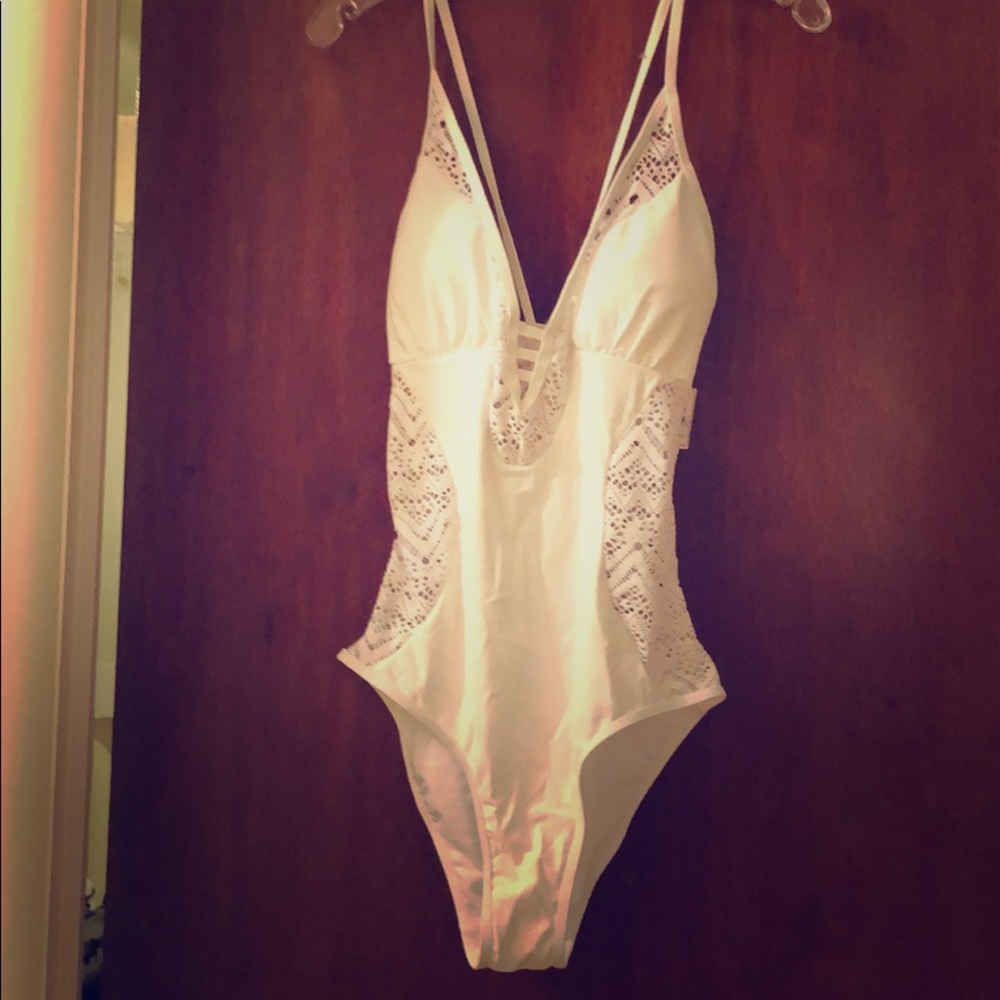 White lace-like laser cut bathing suit